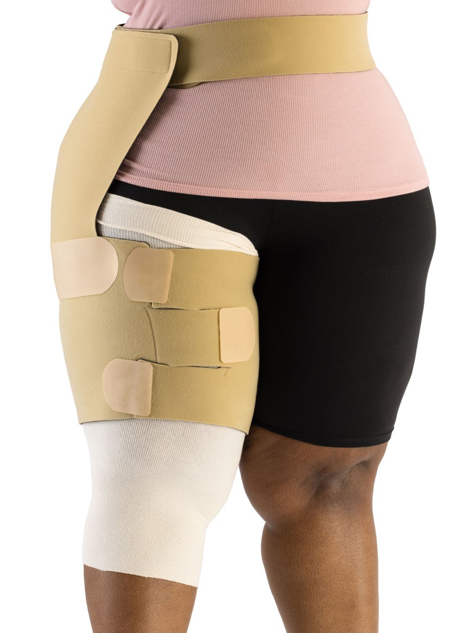 Woman wearing Sigvaris Compreflex Contain Thigh inelastic wrap on right thigh in the color Beige